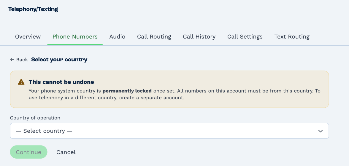 Select your country: a warning that this cannot be undone and the phone system country is permanently locked once set, the Country of operation list, and Continue and Cancel