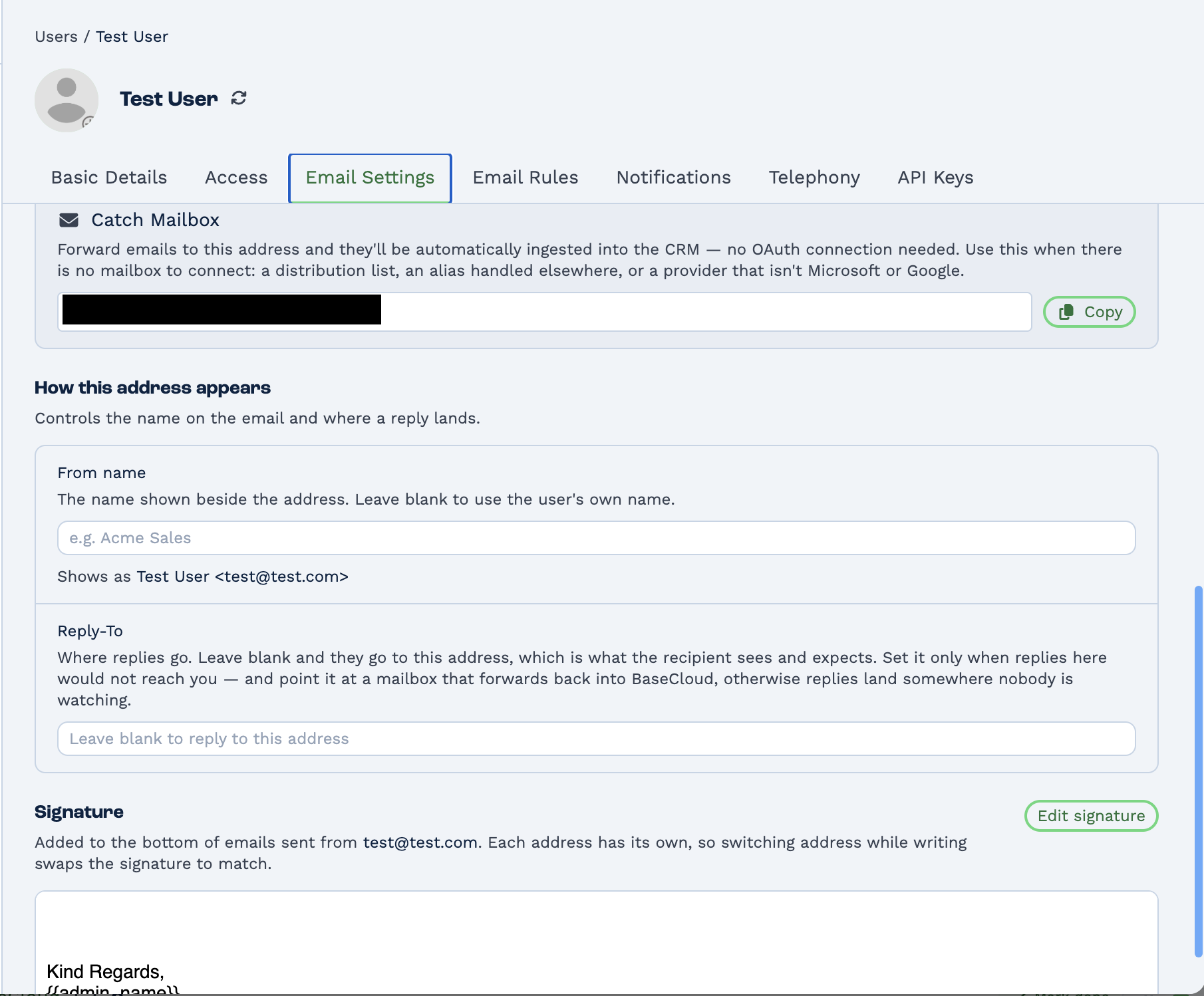 The lower half of a user's Email Settings. A Catch Mailbox section explains that emails forwarded to the address shown are ingested into the CRM automatically with no OAuth connection, for use when there is no mailbox to connect — a distribution list, an alias handled elsewhere, or a provider that is not Microsoft or Google; the address itself is blacked out. Below, a How this address appears section sets the From name and Reply-To, warning that a Reply-To should point at a mailbox that forwards back into BaseCloud or replies land somewhere nobody is watching. A Signature section notes each address has its own signature, so switching address while writing swaps it